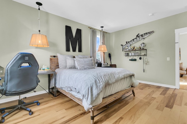 bedroom featuring wood-type flooring