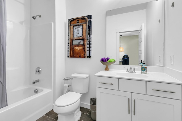 full bathroom with shower / tub combo, vanity, and toilet