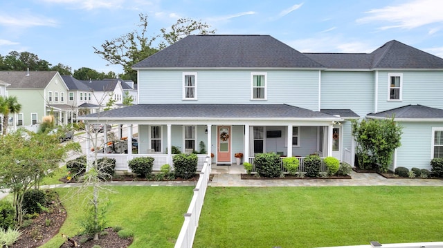 view of front facade with a porch and a front lawn