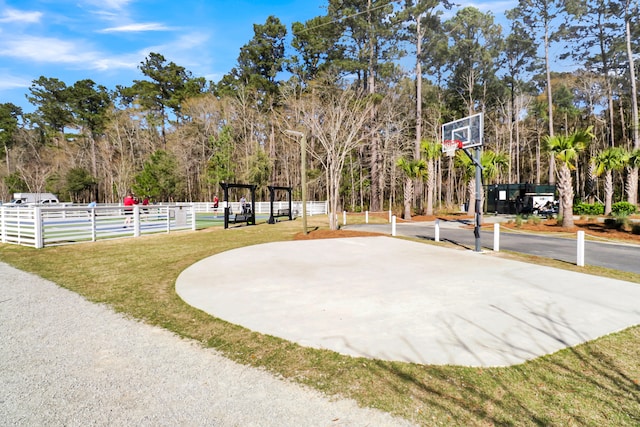 view of basketball court featuring a lawn