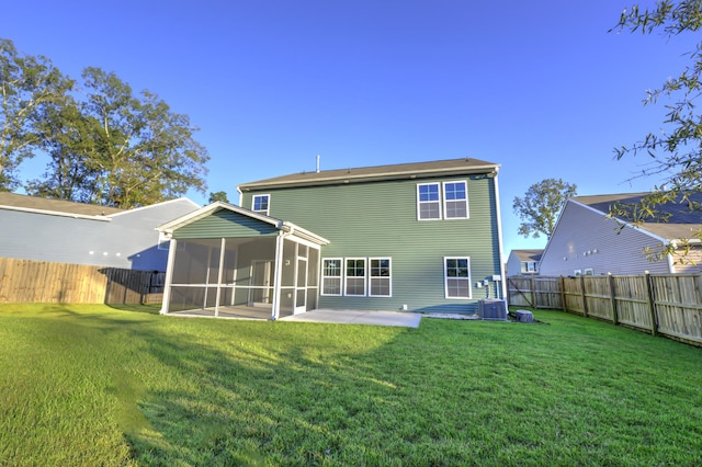 back of house with cooling unit, a lawn, a sunroom, and a patio area