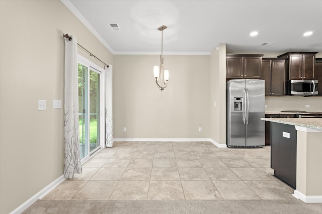 kitchen with crown molding, decorative light fixtures, dark brown cabinets, appliances with stainless steel finishes, and light stone countertops