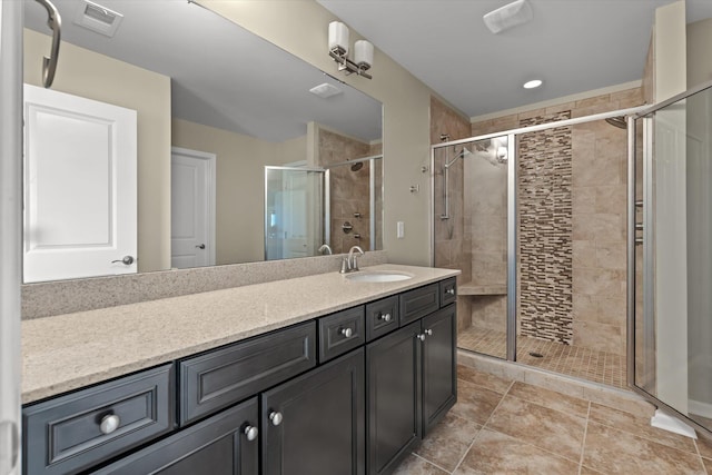 bathroom with walk in shower and vanity