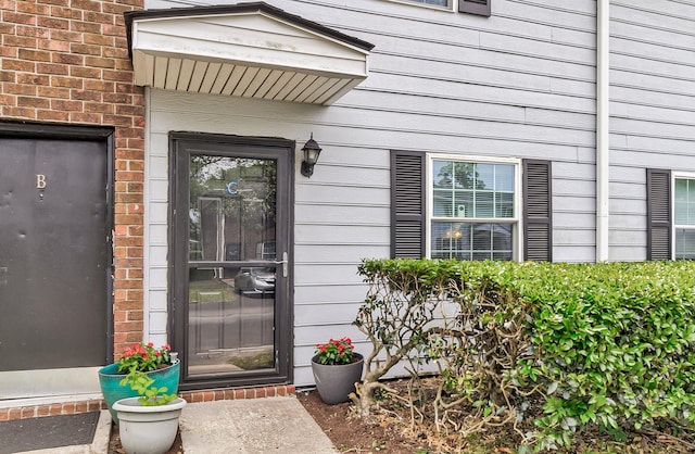 21 Rivers Point Row Apt 11C, Charleston, SC 29412 - doorway to property with brick siding