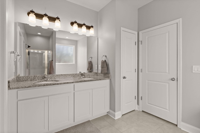 bathroom featuring vanity, tile patterned floors, and an enclosed shower