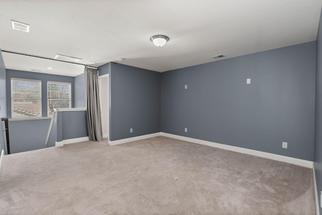 unfurnished room featuring carpet flooring