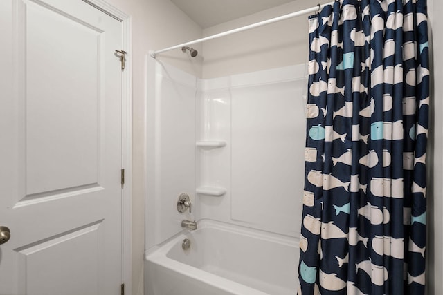 bathroom with shower / bath combo with shower curtain