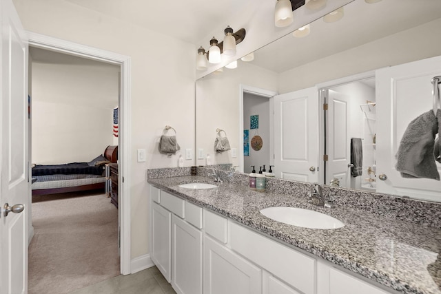 bathroom featuring vanity and tile patterned flooring