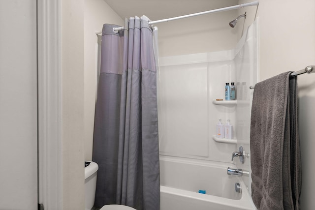 bathroom with toilet and shower / bath combo