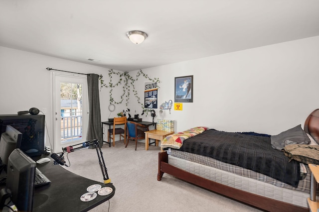 bedroom featuring carpet floors and access to exterior