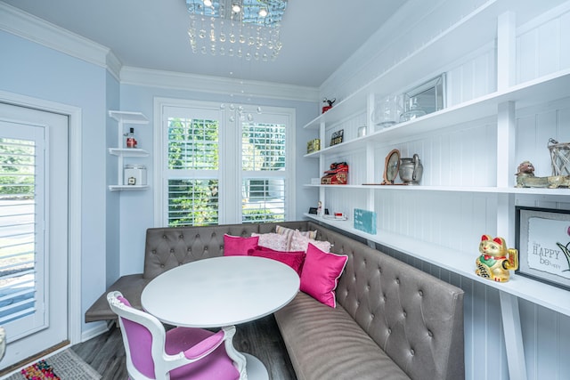 interior space featuring plenty of natural light, wood finished floors, and crown molding