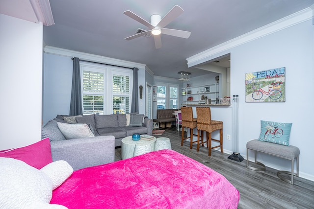 living room featuring ornamental molding, dark wood-style flooring, baseboards, and a ceiling fan