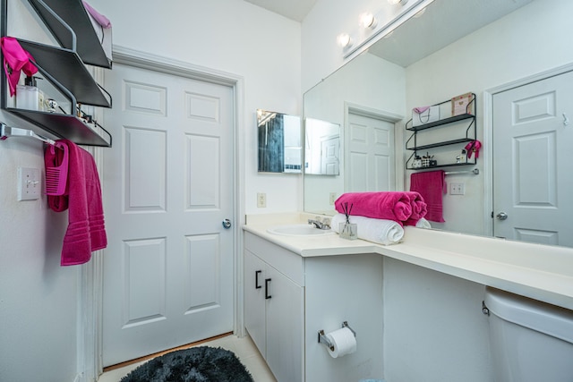 half bath with vanity and toilet