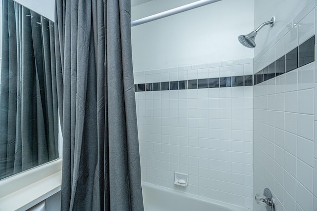 full bathroom with shower / bath combination with curtain