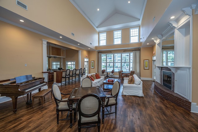 dining room with visible vents, dark wood-type flooring, and crown molding