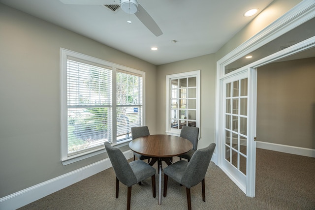 dining space featuring baseboards, dark carpet, and recessed lighting