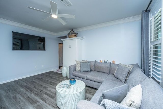 living room with crown molding, visible vents, a ceiling fan, wood finished floors, and baseboards