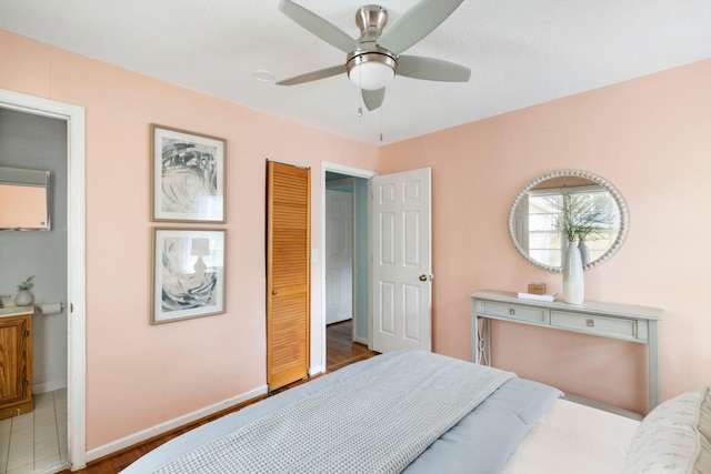 bedroom featuring baseboards and a ceiling fan