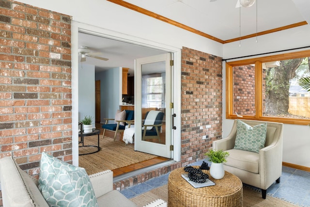 sunroom featuring a ceiling fan