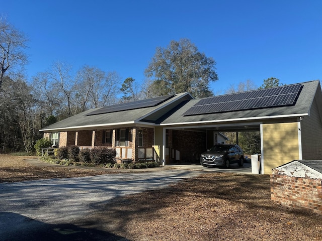 view of front of property featuring a carport