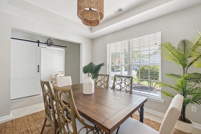 7511 Hawks Cir, Hanahan, SC 29410 - dining area featuring a barn door and light tile patterned floors