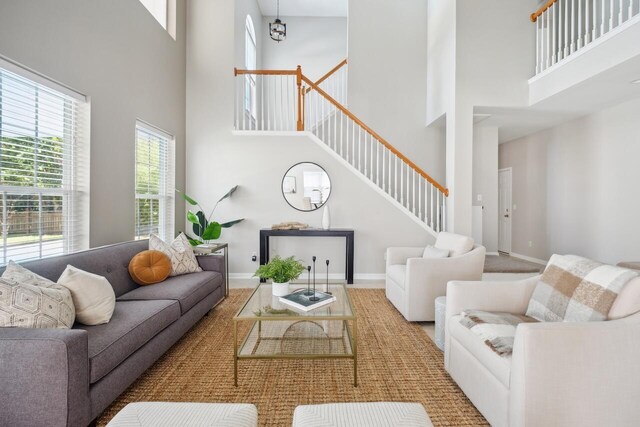 7511 Hawks Cir, Hanahan, SC 29410 - living room with a high ceiling and stairs