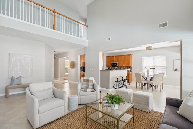 7511 Hawks Cir, Hanahan, SC 29410 - living area featuring light tile patterned floors and a high ceiling