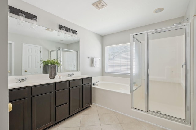 7511 Hawks Cir, Hanahan, SC 29410 - bathroom with a stall shower, tile patterned flooring, a garden tub, and double vanity