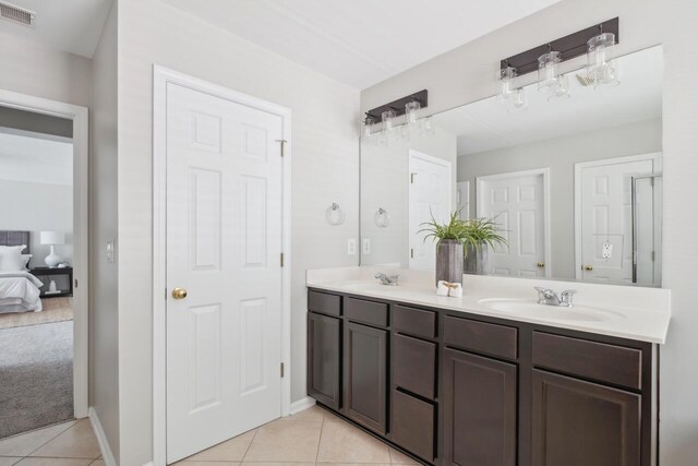 7511 Hawks Cir, Hanahan, SC 29410 - ensuite bathroom with double vanity and tile patterned floors