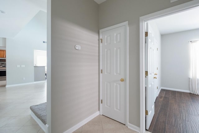 7511 Hawks Cir, Hanahan, SC 29410 - corridor featuring baseboards and light tile patterned flooring