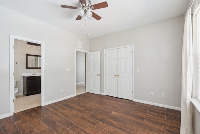 7511 Hawks Cir, Hanahan, SC 29410 - unfurnished bedroom featuring dark wood-style floors, a closet, connected bathroom, and a ceiling fan