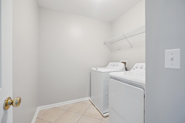 7511 Hawks Cir, Hanahan, SC 29410 - laundry area with washer and clothes dryer and light tile patterned floors