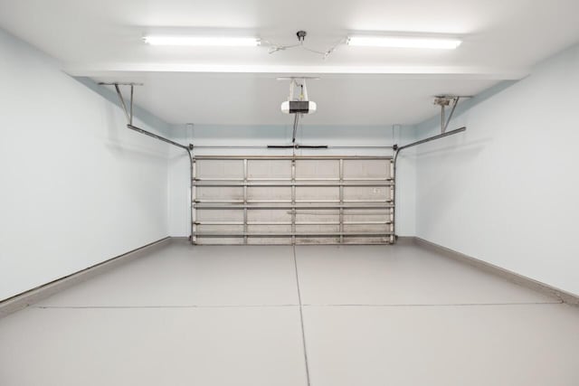 7511 Hawks Cir, Hanahan, SC 29410 - garage with a garage door opener and baseboards