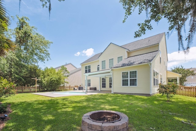 7511 Hawks Cir, Hanahan, SC 29410 - back of house featuring a fire pit, a fenced backyard, a patio, and a shingled roof