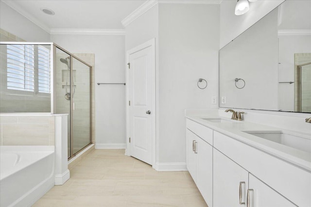 full bath featuring ornamental molding, a sink, and a shower stall