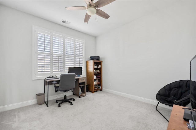 office featuring carpet flooring, visible vents, and baseboards