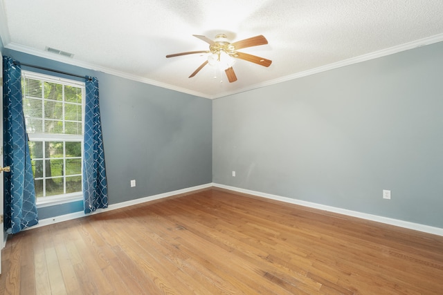 unfurnished room with ornamental molding, light wood-type flooring, and ceiling fan