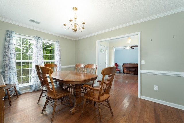 dining room with ornamental molding, ceiling fan with notable chandelier, and hardwood / wood-style flooring