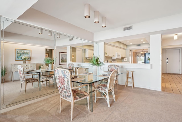 view of carpeted dining room