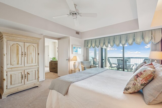 bedroom with ceiling fan, access to outside, and light colored carpet