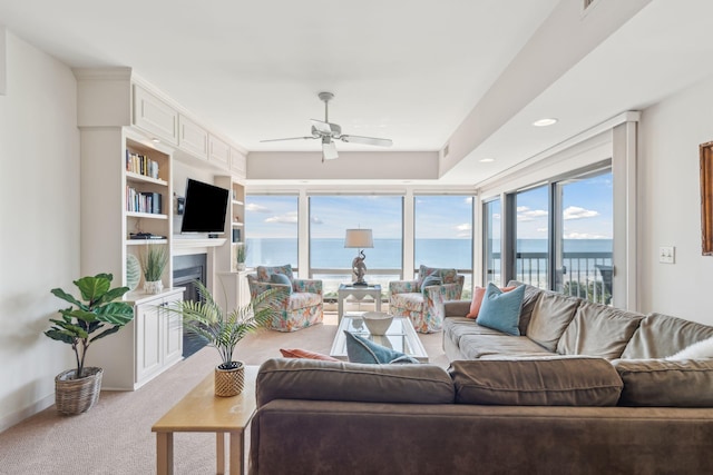 living room with ceiling fan and light carpet