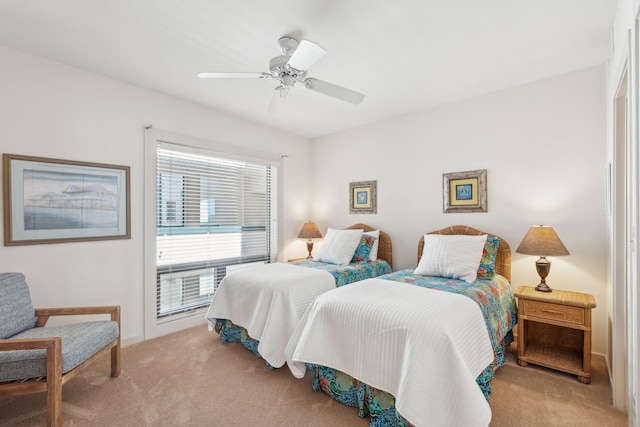 bedroom featuring light colored carpet and ceiling fan