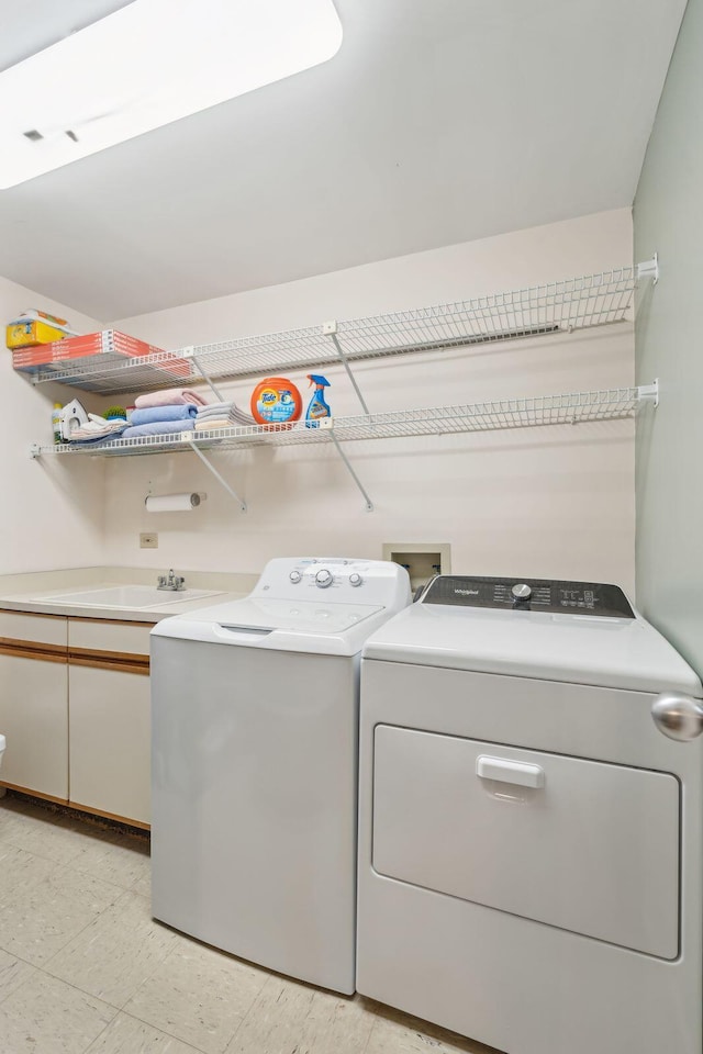 washroom featuring light tile patterned flooring and separate washer and dryer