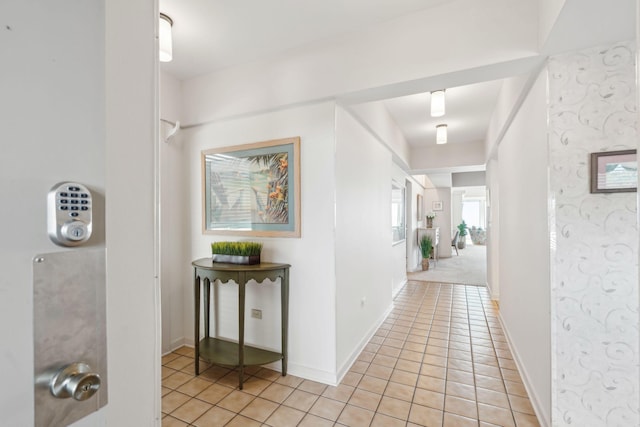 hallway with light colored carpet