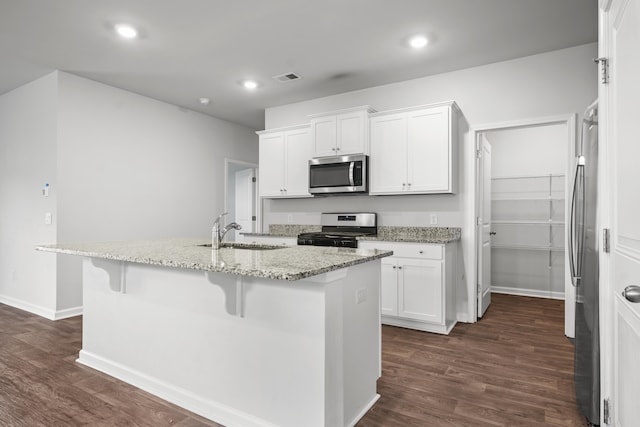 1032 Peridote Way, Ladson, SC 29456 - kitchen with stainless steel appliances, dark wood-type flooring, white cabinetry, and recessed lighting