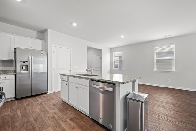 1032 Peridote Way, Ladson, SC 29456 - kitchen with stainless steel appliances, white cabinetry, dark wood-type flooring, light stone counters, and recessed lighting
