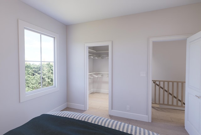 2161 W Jimtown Dr Unit 101, North Charleston, SC 29405 - unfurnished bedroom featuring wood finished floors, a spacious closet, and a closet