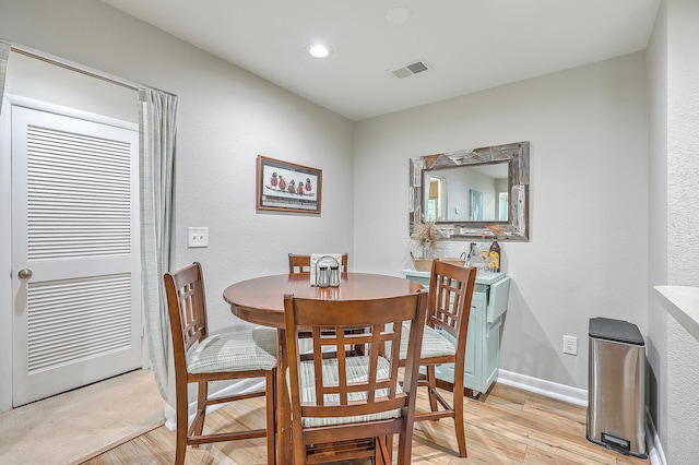 dining room featuring light hardwood / wood-style flooring