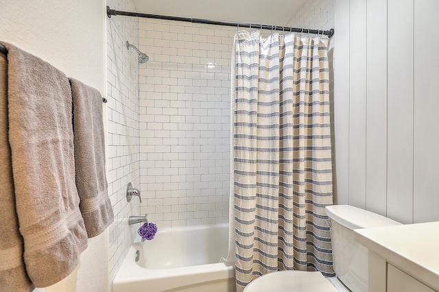 full bathroom with toilet, shower / bath combo with shower curtain, and vanity