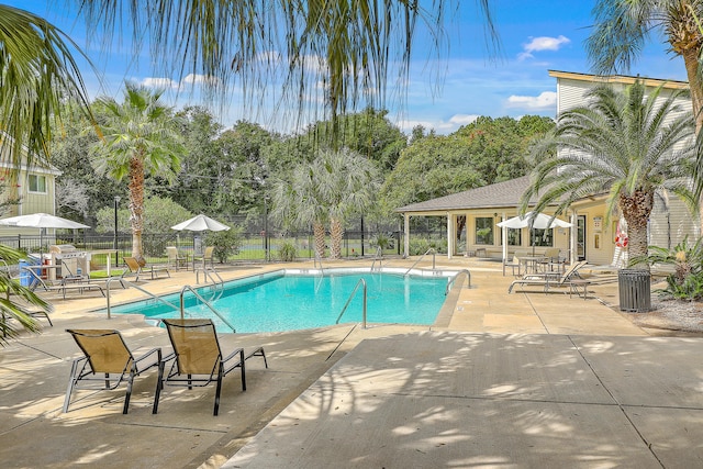 view of swimming pool with a patio